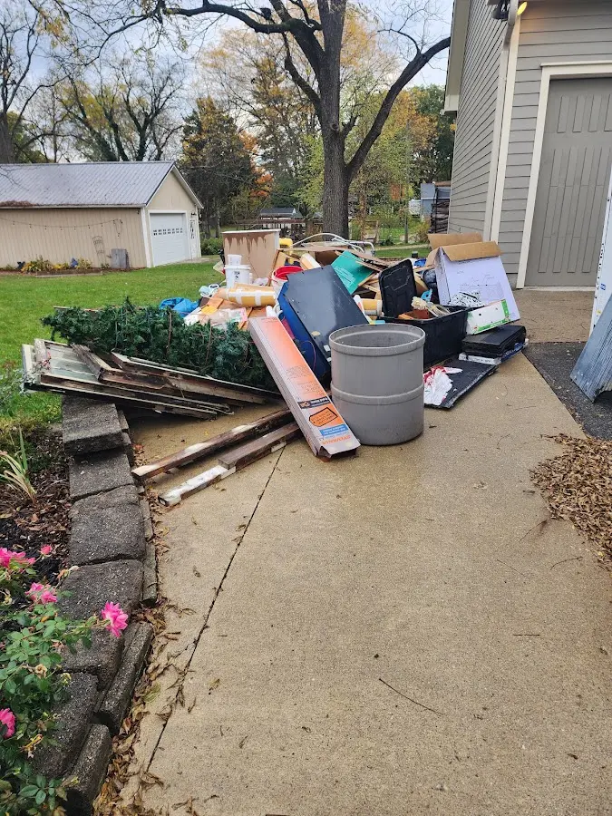Dumpster being loaded with debris for Roofing Dumpster Rental in Big Coppitt Key